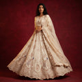 Ivory bridal lehenga with zardozi peacock and floral embroidery motifs