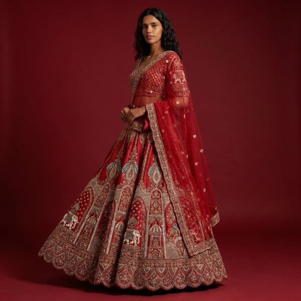 Red designer lehenga with heavy gold-and-silver zardosi embroidery and flared skirt