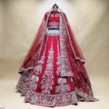 Embroidered bridal lehenga with vertical paneling, maroon skirt and silver bead details