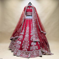 Cherry red raw silk bridal lehenga with pearl and zari floral stems and two net dupattas draped as a veil