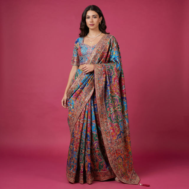 Teal blue multicolour printed saree with embroidered pallu and border, worn by model