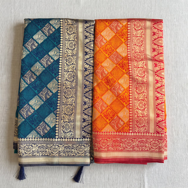 Banarasi art silk bandhni pattern saree with zari paisley checks in teal blue and orange