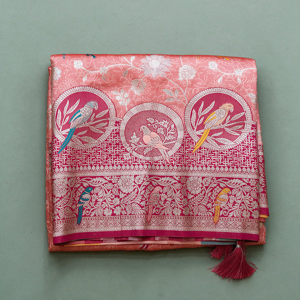 Banarasi Art Silk Gifting Saree with Parrot Medallion Border in peach and rani pink, folded