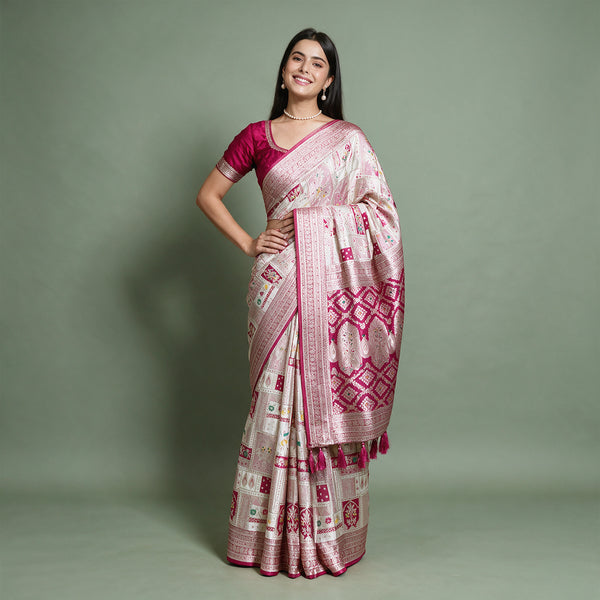 Banarasi Art Silk Gifting Saree with Patchwork Zari Weave & Rani Pink Border in white and rani pink, worn by a model