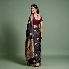 Black silk saree back drape with velvet polka dots and wide gold zari border