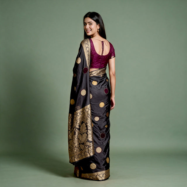 Black silk saree back drape with velvet polka dots and wide gold zari border