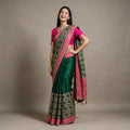 Bottle green silk saree with colorful resham and zari border, pink pallu border