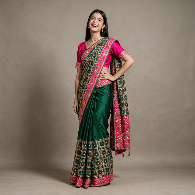 Bottle green silk saree with colorful resham and zari border, pink pallu border