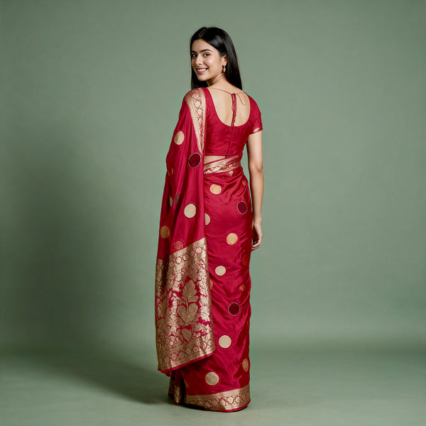 Cherry red silk saree with velvet polka dots, zari border, open-back drape