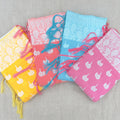 Cotton sarees with white paisley border and tassels in four colours