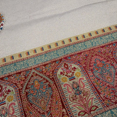 Saree border close-up with geometric arch pattern in red, teal, gold and cream