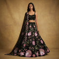 Black sequin floral embroidered cocktail lehenga with pink motifs and sheer dupatta