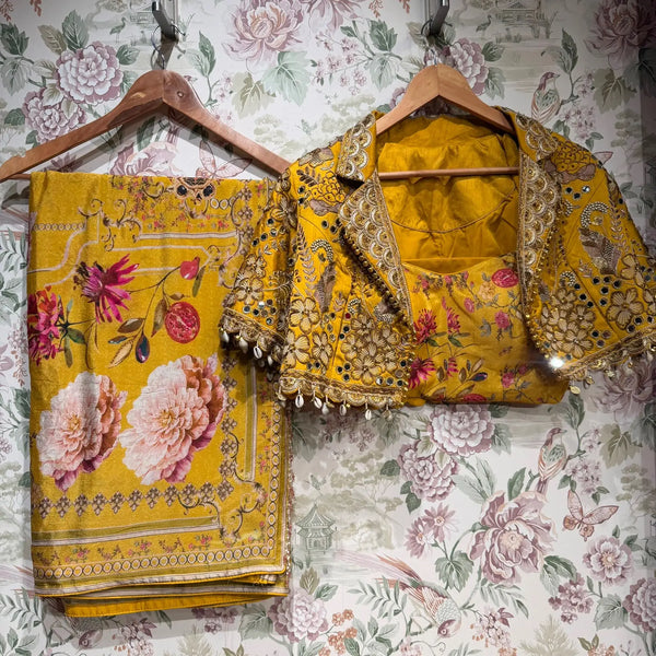 Mustard floral printed saree with embellished border and matching jacket blouse