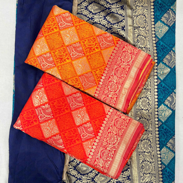 Orange silk saree with lattice bandhej pattern and red-gold border trim