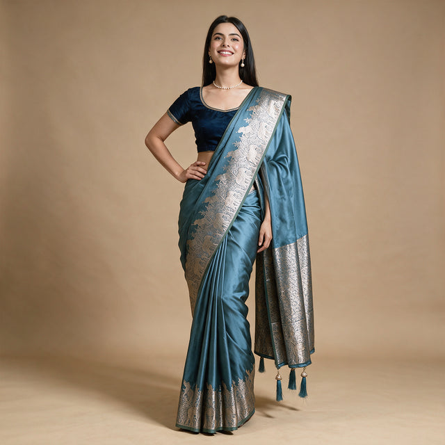 Satin Gifting Saree with Zari Elephant Border in teal, worn by a model