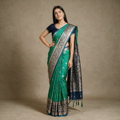 Emerald Green Banarasi Art Silk Saree with Zari Butis & Navy Blue Floral Border, worn by a model