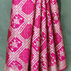 Rani pink gharchola satin saree, close-up of the zari check weave