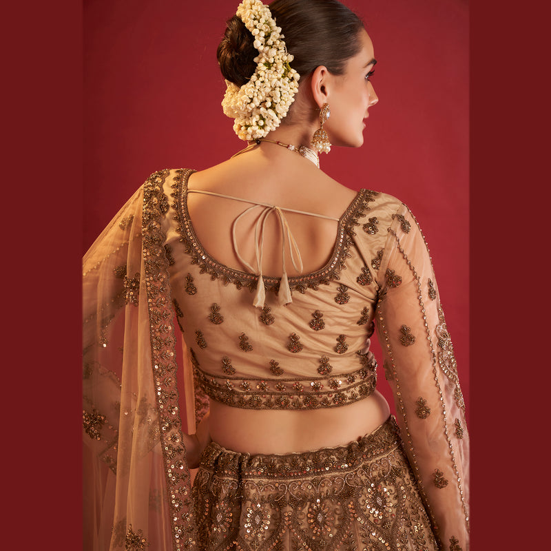 Stylish golden lehenga with beads, featuring intricate embroidery and a matching dupatta