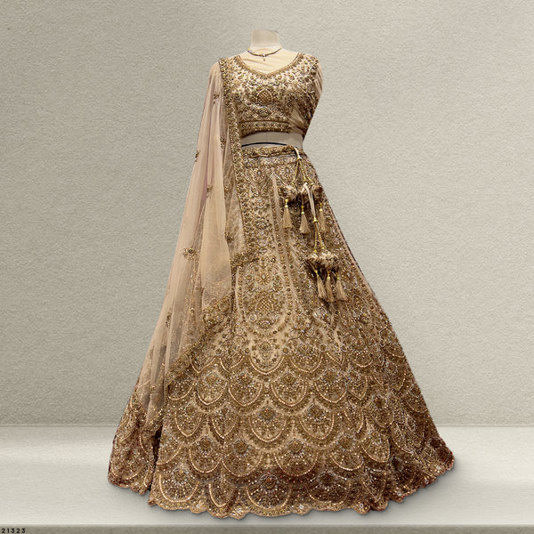 Stunning golden lehenga with beads featuring intricate embroidery and elegant dupatta for festive occasions