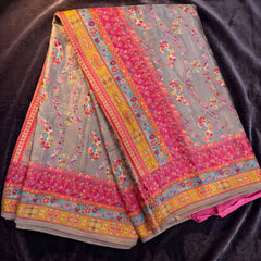 Grey position print saree in pure viscose, opened out to show the border and pallu