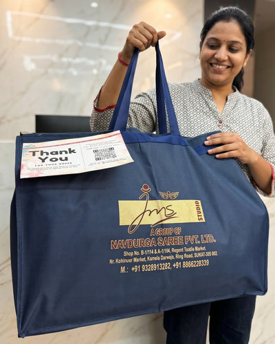 A finished JMS Studio order packed in a branded bag with a thank-you note