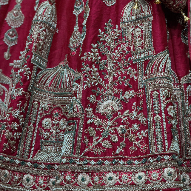 Rani pink raw silk bridal lehenga with ornate Jharoka motif embroidery and border