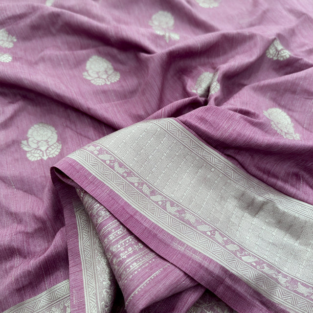 Mauve saree fabric close-up with gold and silver zari border and floral motifs