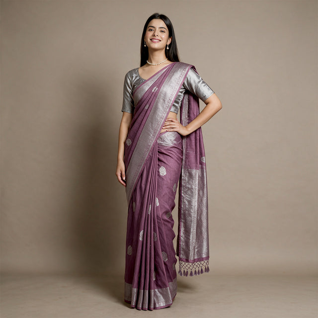 Mauve linen-cotton saree with silver zari border and scattered floral butas
