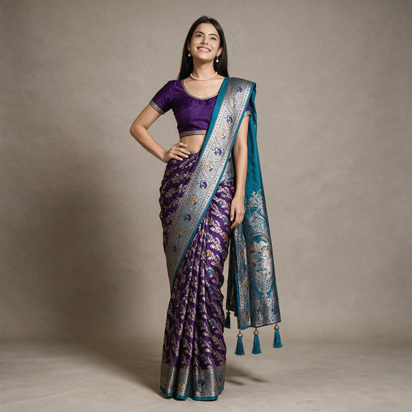 Satin Gifting Saree with Meenakari Leaf Jaal & Contrast Border in purple with a teal border, worn by a model