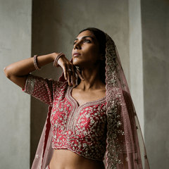 Pink velvet blouse with red and silver embroidery, sheer pink dupatta and tassel trim