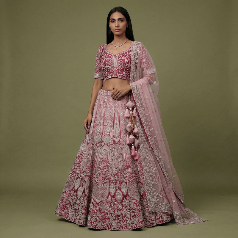 Embroidered pink velvet wedding lehenga with embellished blouse and sheer dupatta