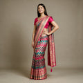 Multicolour zigzag Banarasi silk saree with rani pink zari border