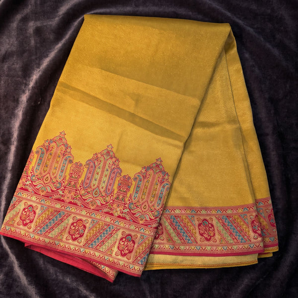 Mustard yellow silk saree with red patterned border and decorative pallu motifs