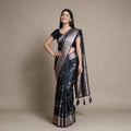 Satin Gifting Saree with Zari Floral Vine & Paisley Border in navy with a purple edge, worn by a model