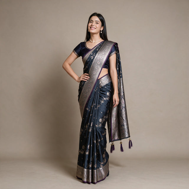 Satin Gifting Saree with Zari Floral Vine & Paisley Border in navy with a purple edge, worn by a model