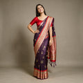 Purple Banarasi Art Silk Saree with Zari Butas & Red Temple Border, worn by a model