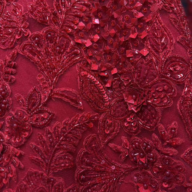 Red embellished bodice fabric with sequins, beadwork, and floral embroidery details