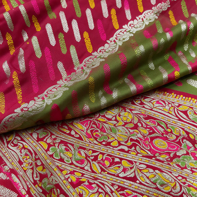Magenta and green silk fabric with gold and silver zari motifs and embroidered butis