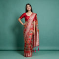 Red Banarasi-style silk saree with zari floral border and patchwork motifs