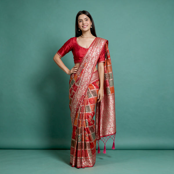 Red Banarasi-style silk saree with zari floral border and patchwork motifs