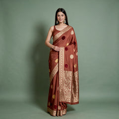 Rust satin saree with woven velvet polka dots and zari border, draped front view