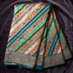 Teal Blue position print saree in pure viscose, opened out to show the border and pallu