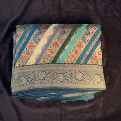 Teal Blue position print saree in pure viscose, folded view