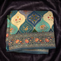 Teal Blue position print saree in pure viscose, folded view