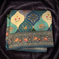 Teal Blue position print saree in pure viscose, folded view