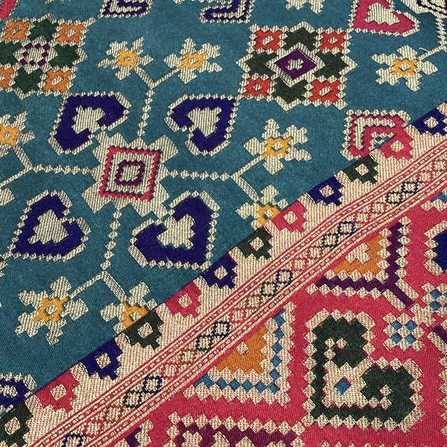 Teal position print saree in pure viscose, close-up of the print