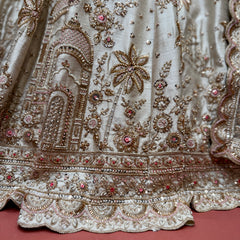 Embroidered ivory lehenga skirt hem with bead and floral jharoka motifs