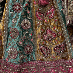 Intricately designed velvet maroon bridal lehenga with elaborate embroidery and rich colors