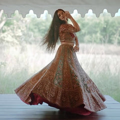 Elegant velvet maroon bridal lehenga with intricate embroidery and matching choli, perfect for weddings