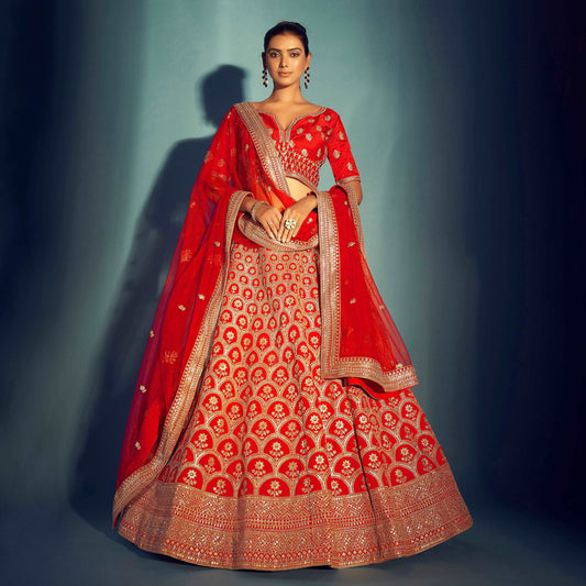 Elegant red Lehenga Choli from JMS Studio with intricate embroidery and sheer dupatta